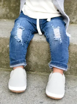 Distressed denim jeans