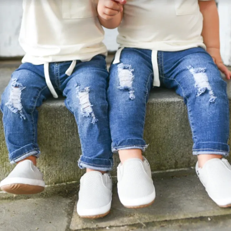 Distressed denim jeans